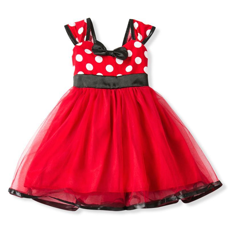 Red polka dot dress with black accents on a white background