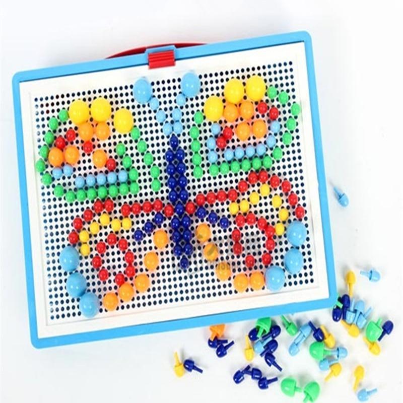 Colorful magnetic dot board with variously shaped magnets on a white background