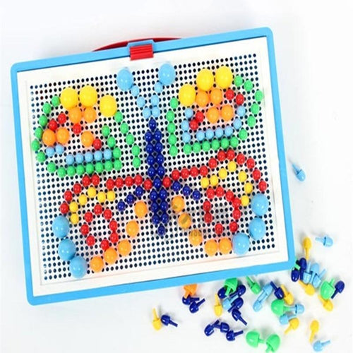 Colorful magnetic dot board with variously shaped magnets on a white background