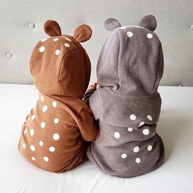 Two children's hoodies with deer designs on a light background