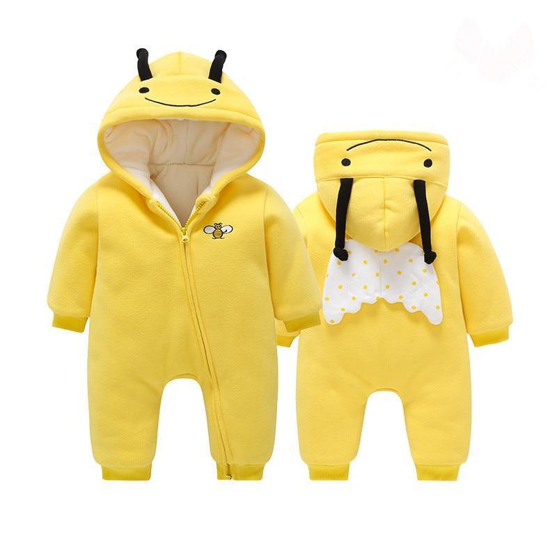 Two yellow baby rompers with bee designs on a white background
