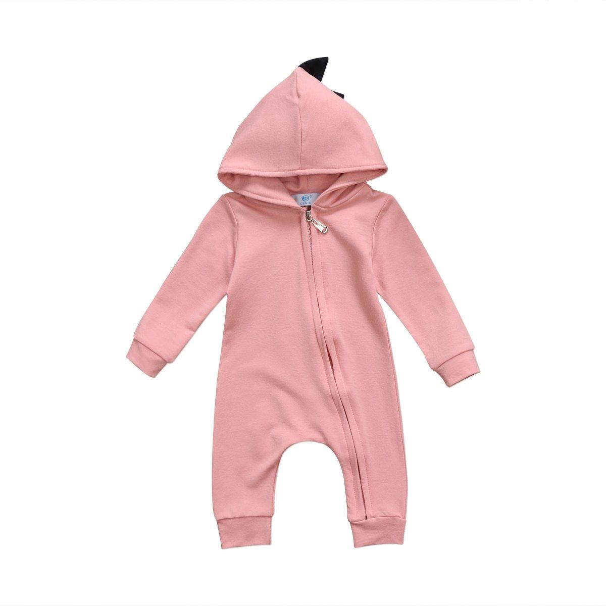 Pink baby onesie with a hood on a white background