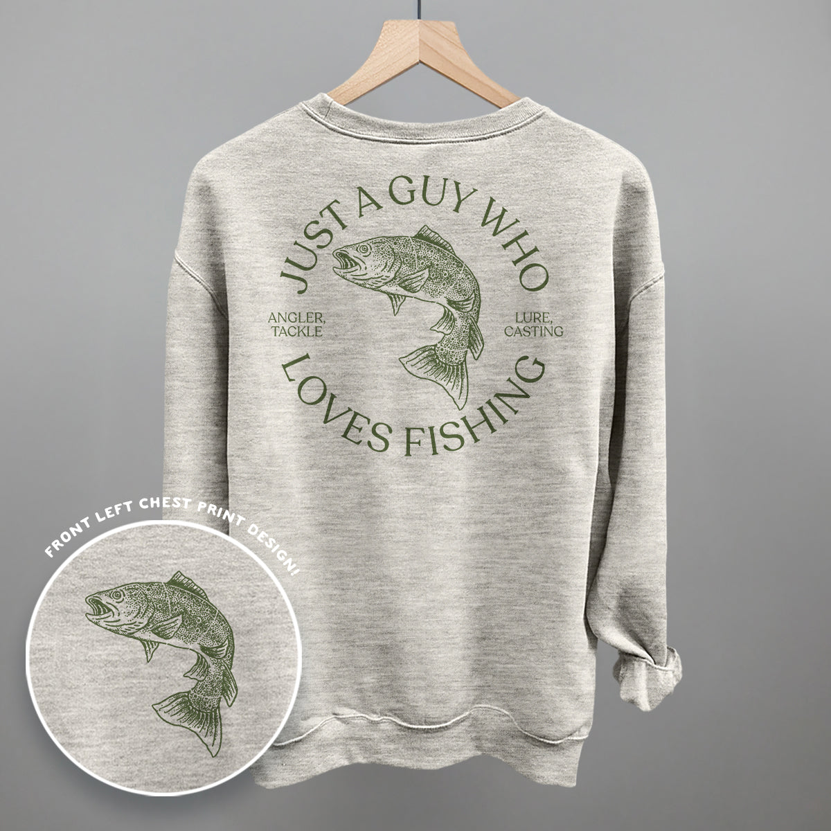 Gray sweatshirt with fishing graphic and text on a hanger against a gray background