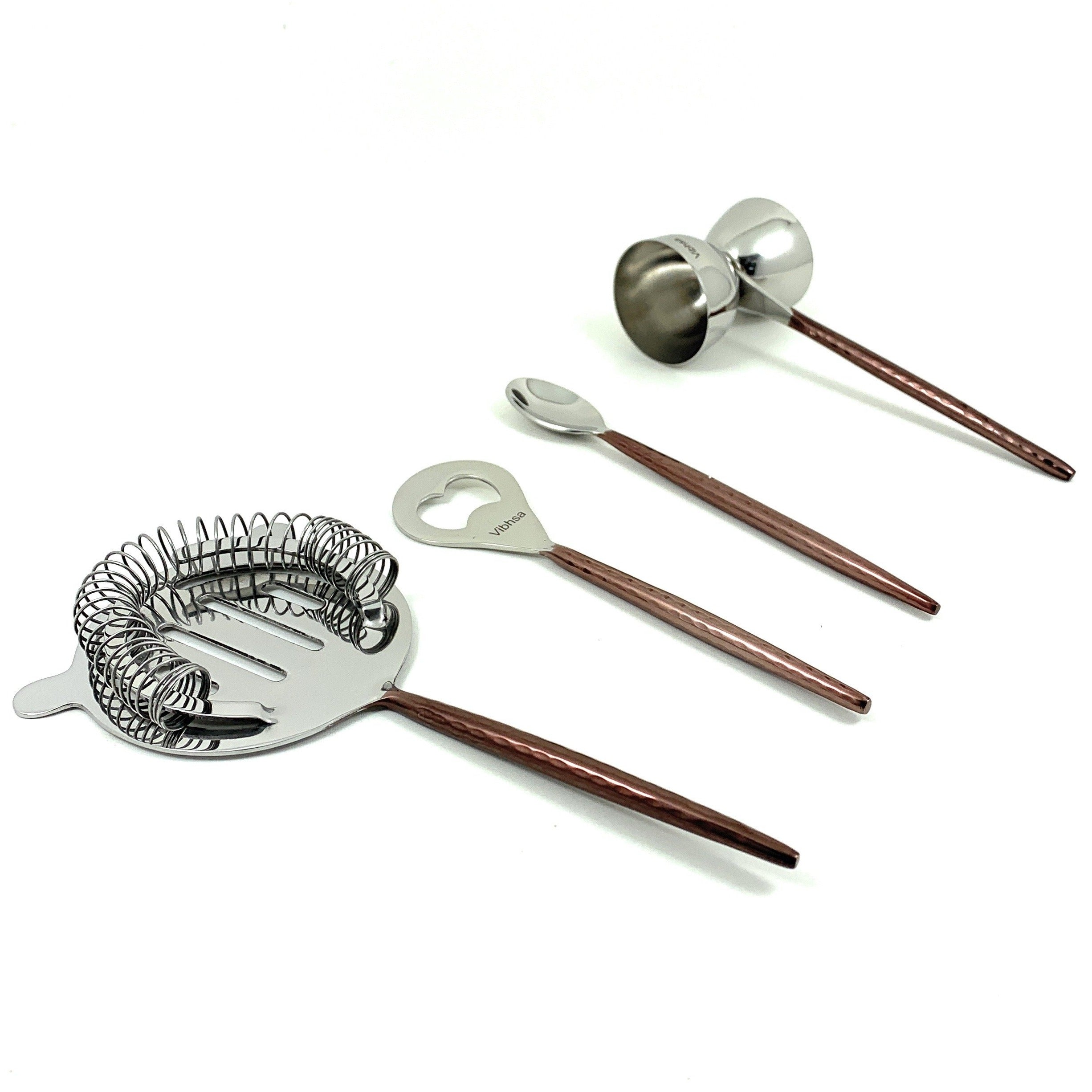 Set of cocktail strainers and tools on a white background