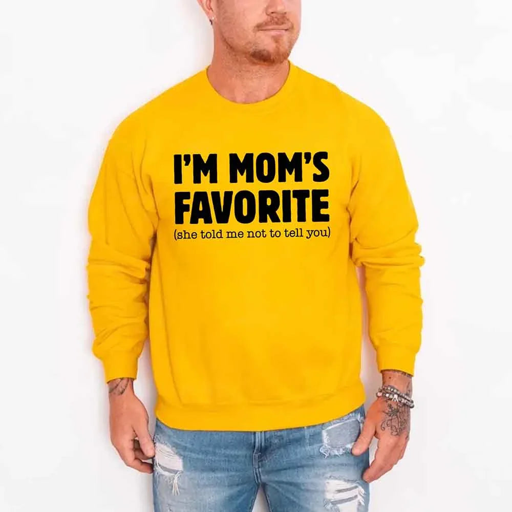 Person wearing a yellow sweatshirt with text on a white background