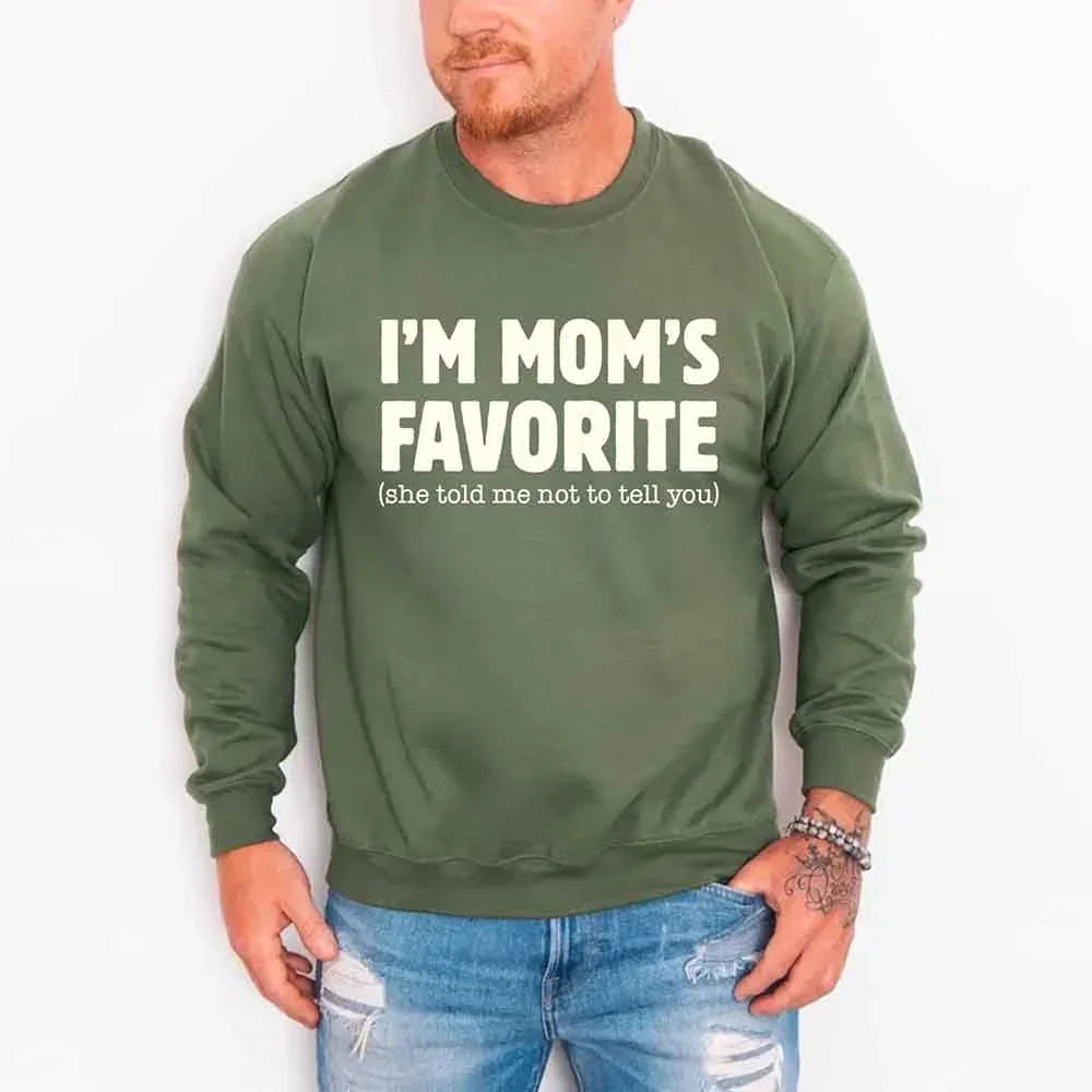 Person wearing a green sweatshirt with text on a white background