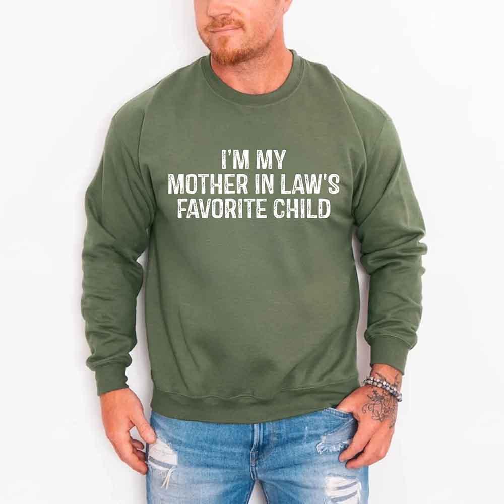 Person wearing a green sweatshirt with text, standing against a white background