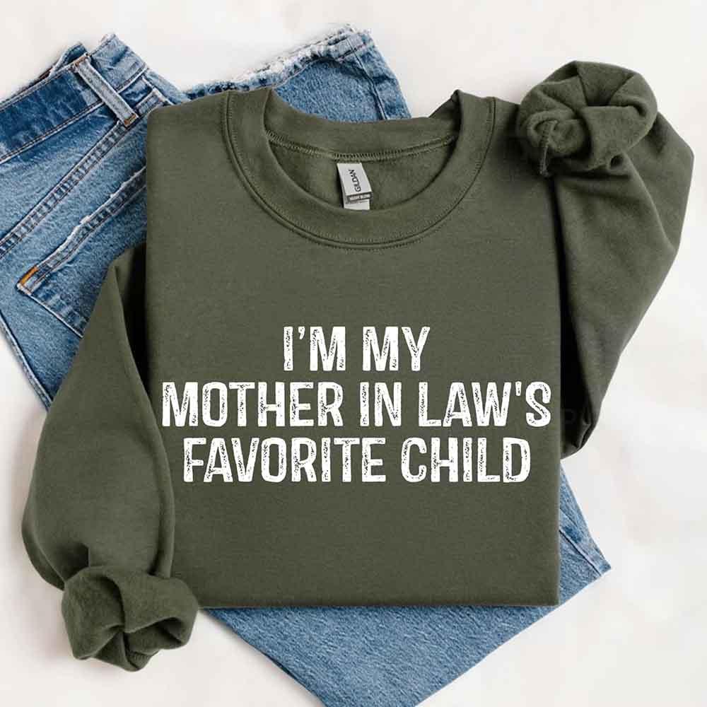 Green sweatshirt with 'I'm my mother in law's favorite child' text on a white background