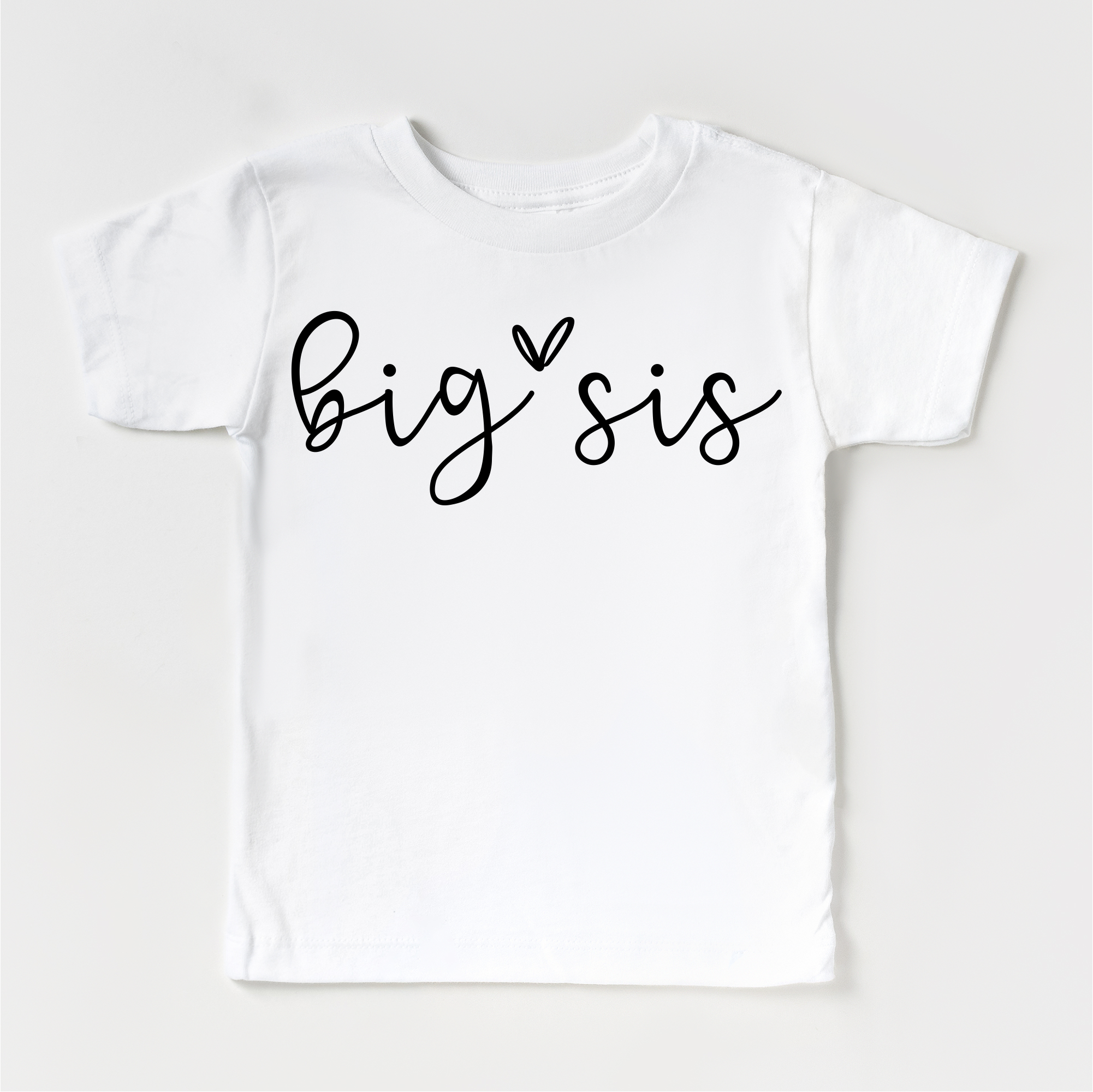White t-shirt with 'big sis' text on a white background