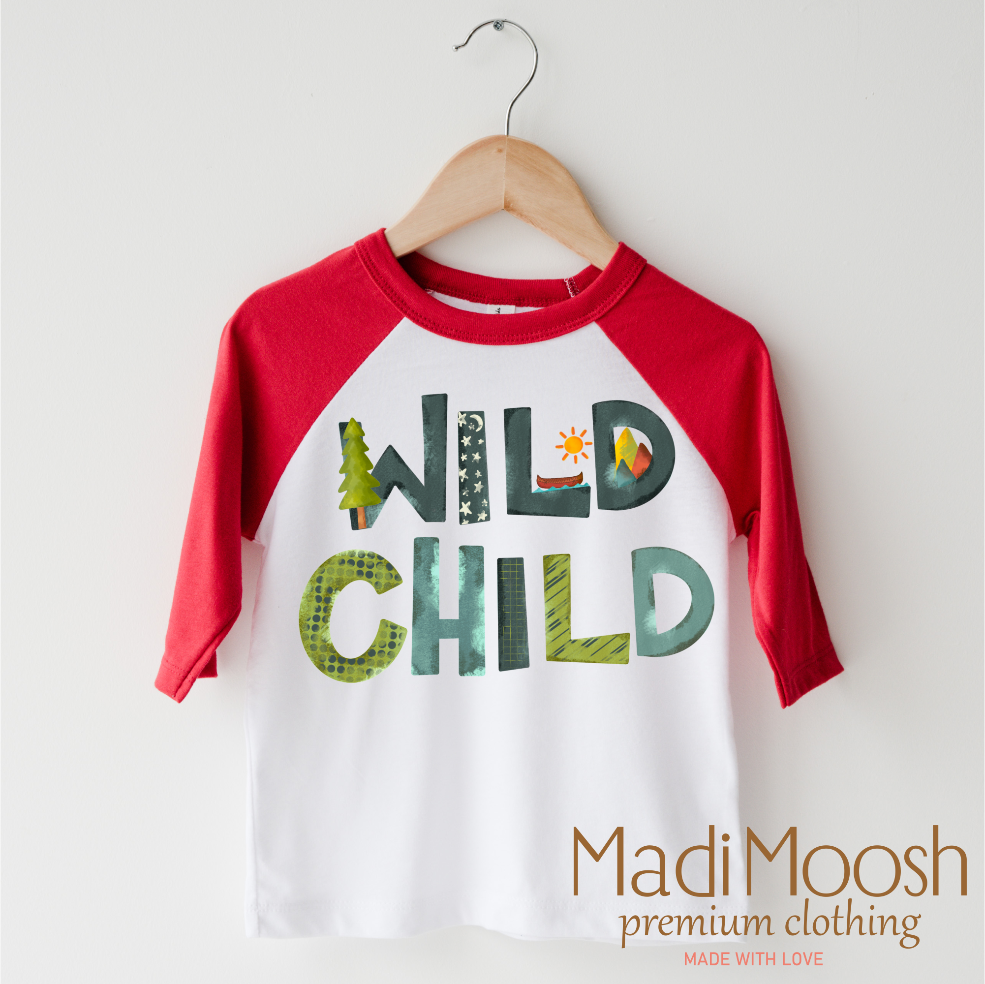 Children's 3/4 sleeve shirt with 'Wild Child' text on a hanger, branded as Madi Moosh.