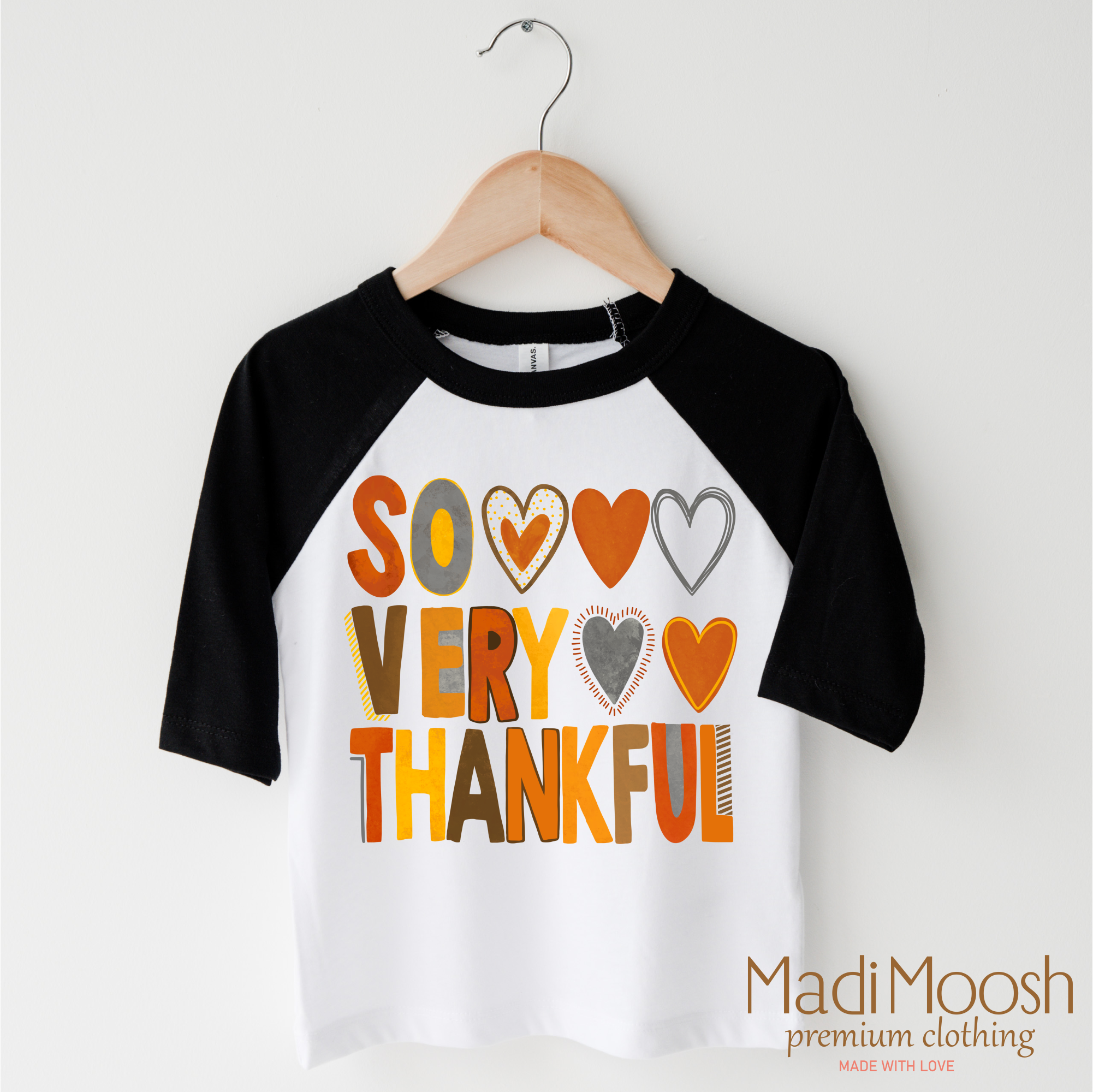 Children's 3/4 sleeve shirt with 'So Very Thankful' text on a hanger, featuring Madi Moosh branding.
