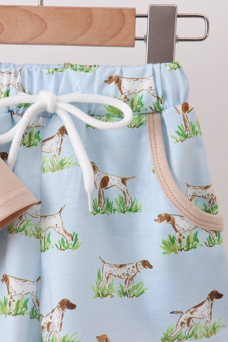 Drawstring bag with dog pattern on a hanger against a light blue background