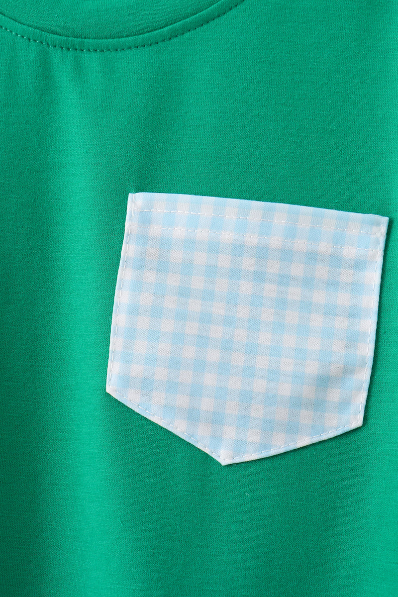 Green shirt with a light blue and white checkered pocket