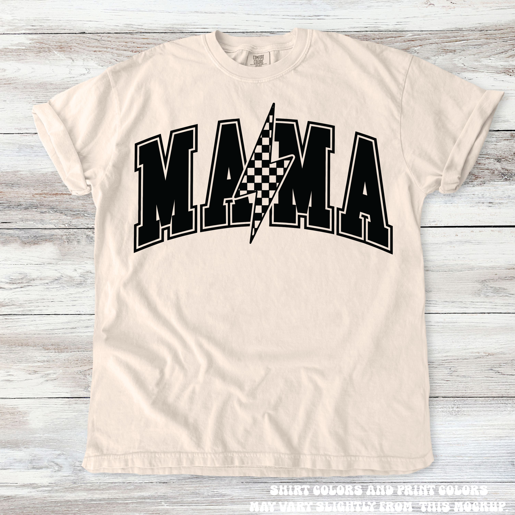 Beige t-shirt with 'MAMA' print on a wooden surface