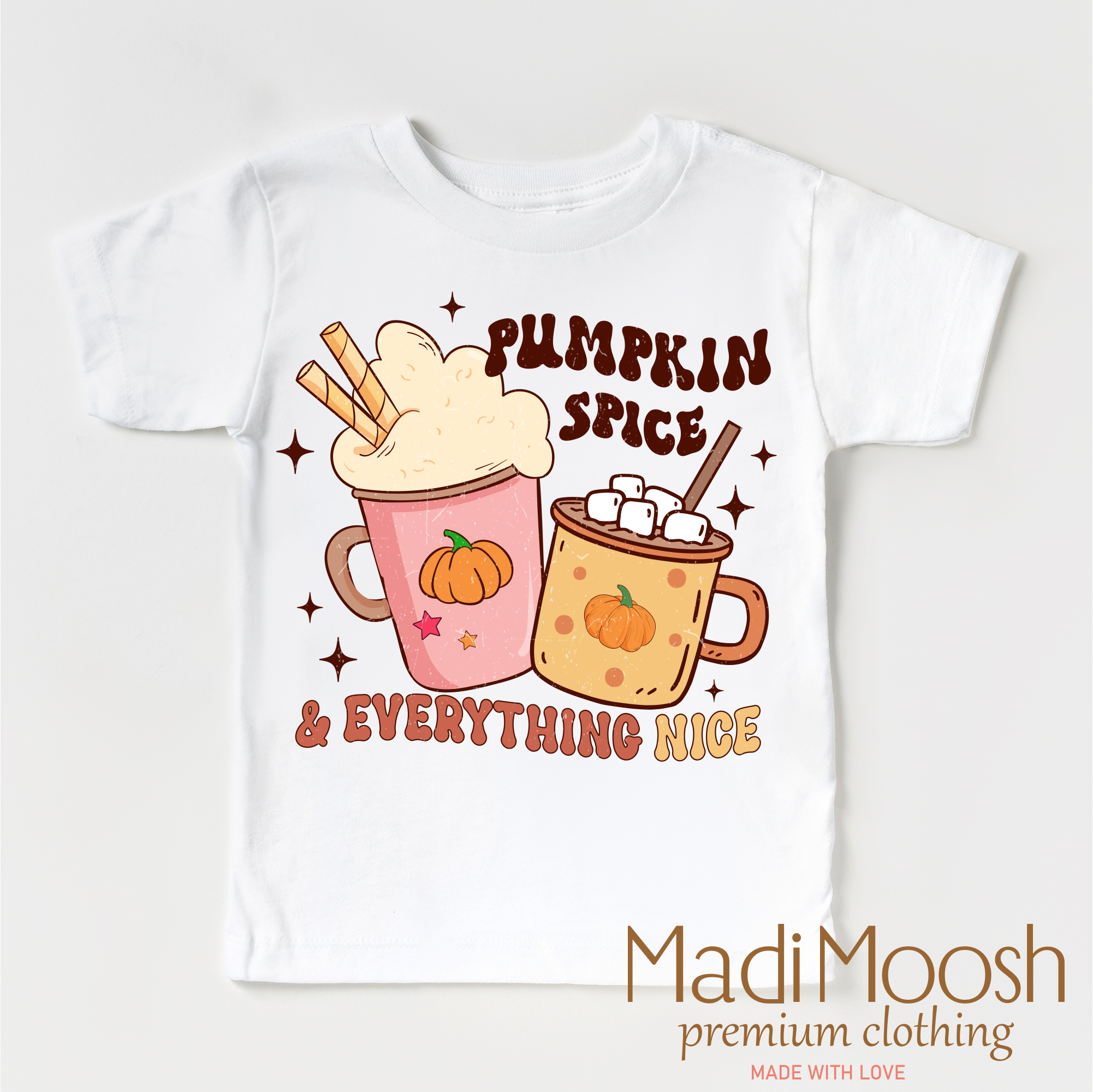 White t-shirt with pumpkin spice and everything nice graphic design on a white background, featuring the brand Madi Moosh.