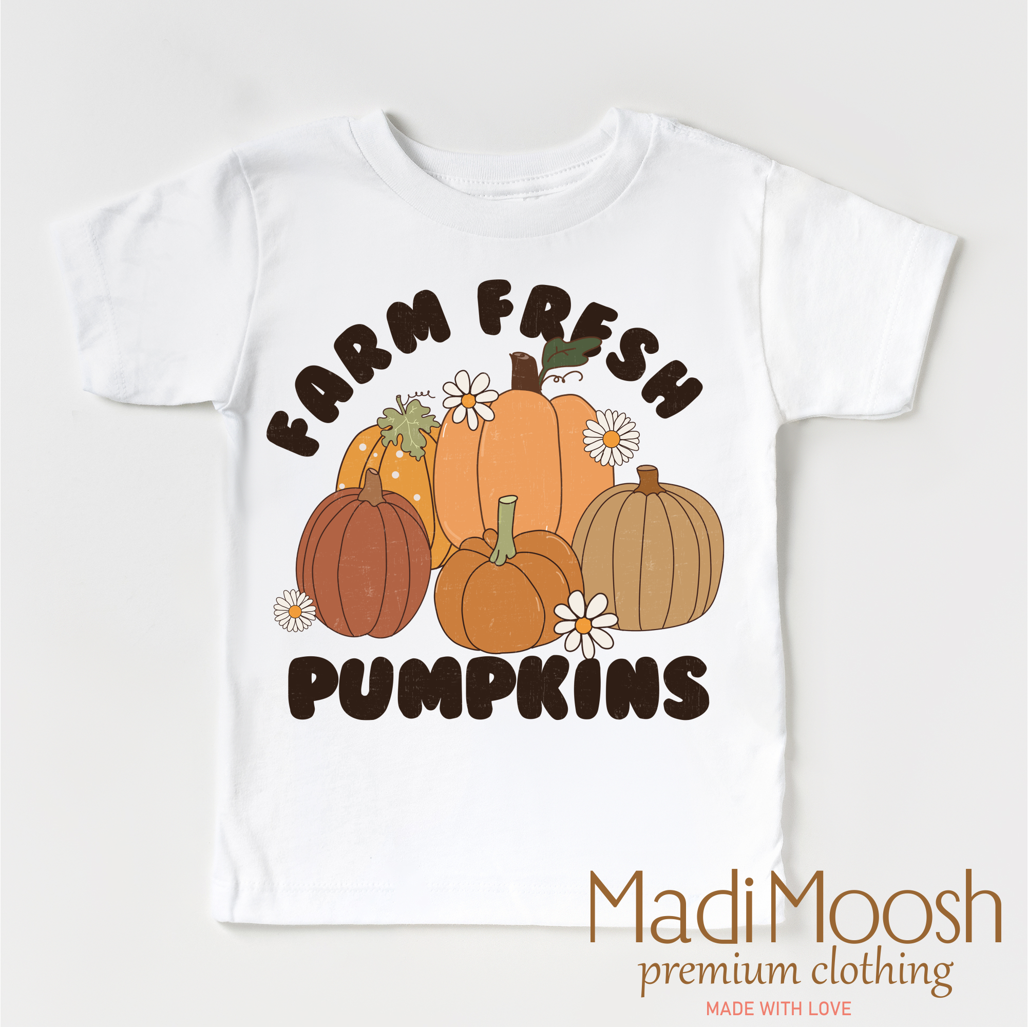 White t-shirt with 'Farm Fresh Pumpkins' design and Madi Moosh branding on a white background