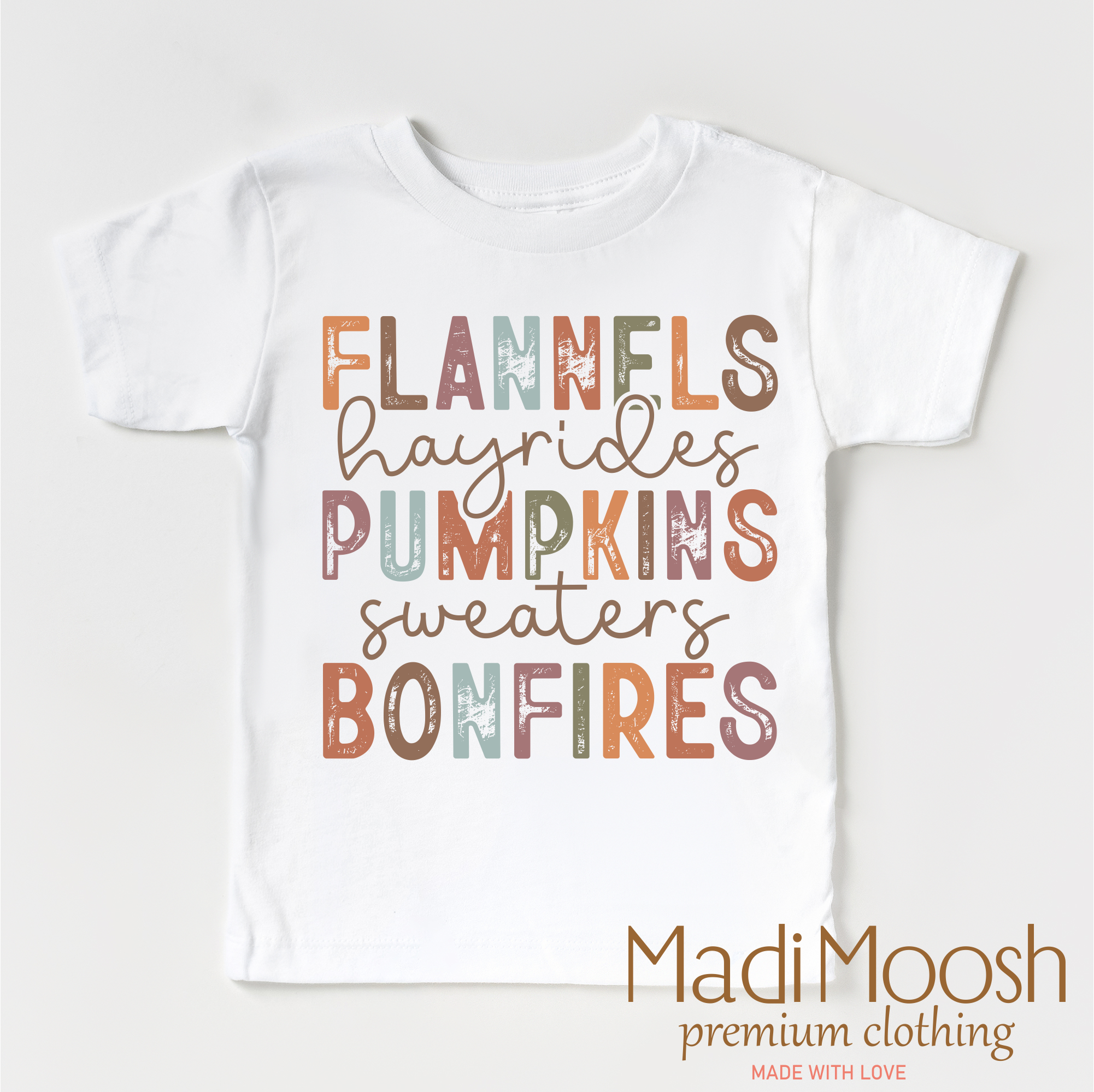 White baby onesie with colorful text on a white background, featuring the brand 'Madi Moosh'.