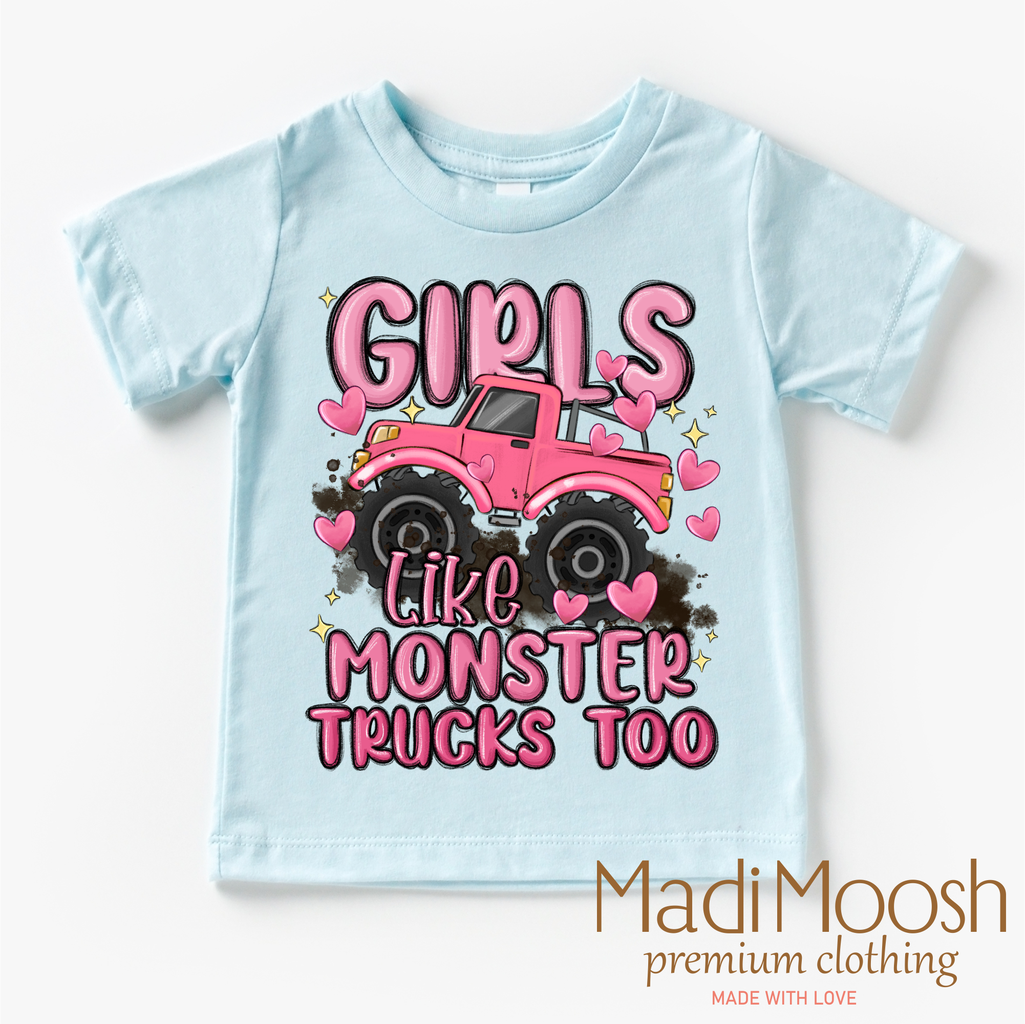 Light blue t-shirt with pink monster truck graphic and text on a white background