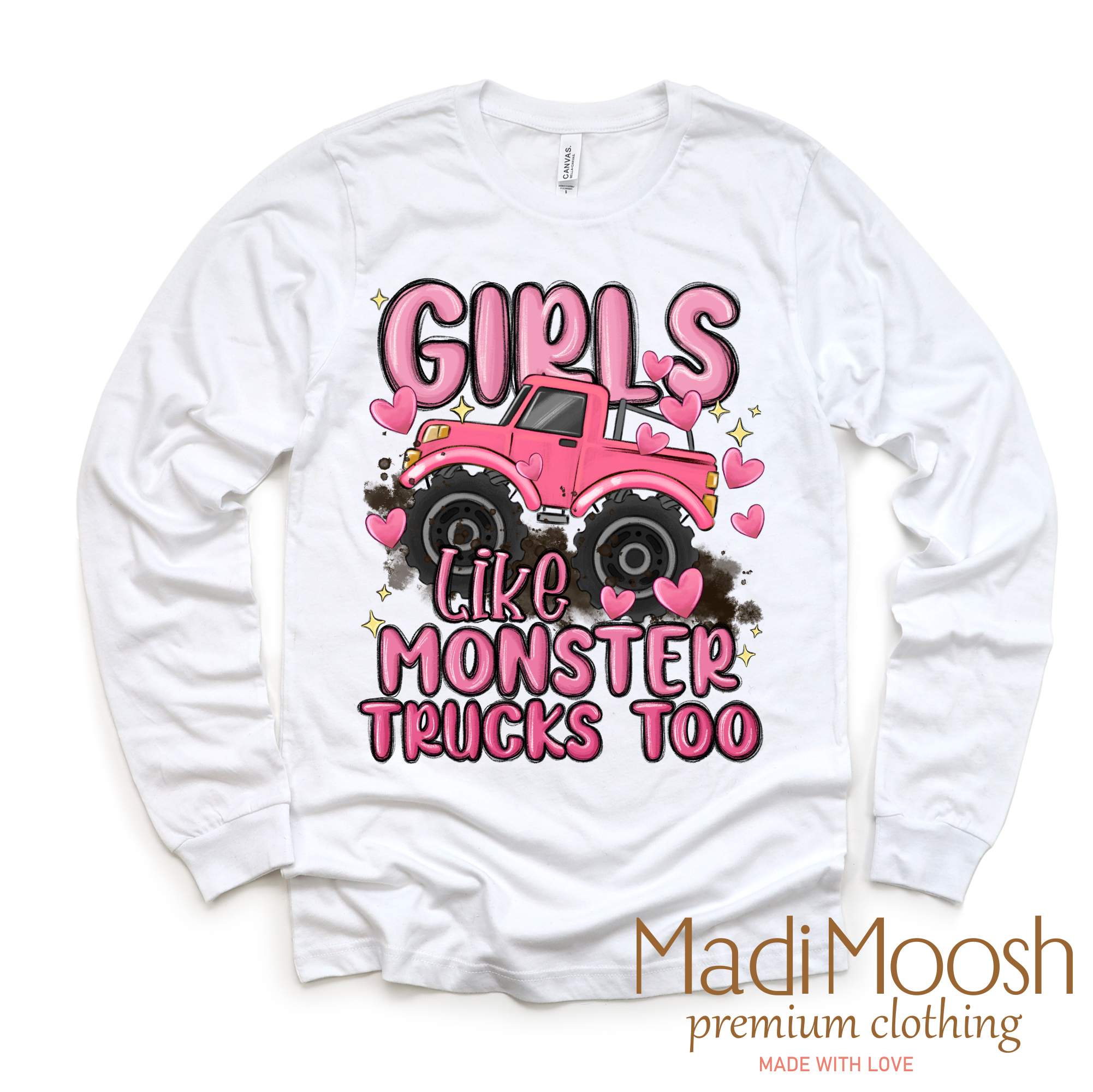 White long sleeve shirt with pink monster truck graphic and text 'Girls Like Monster Trucks Too' on a white background.