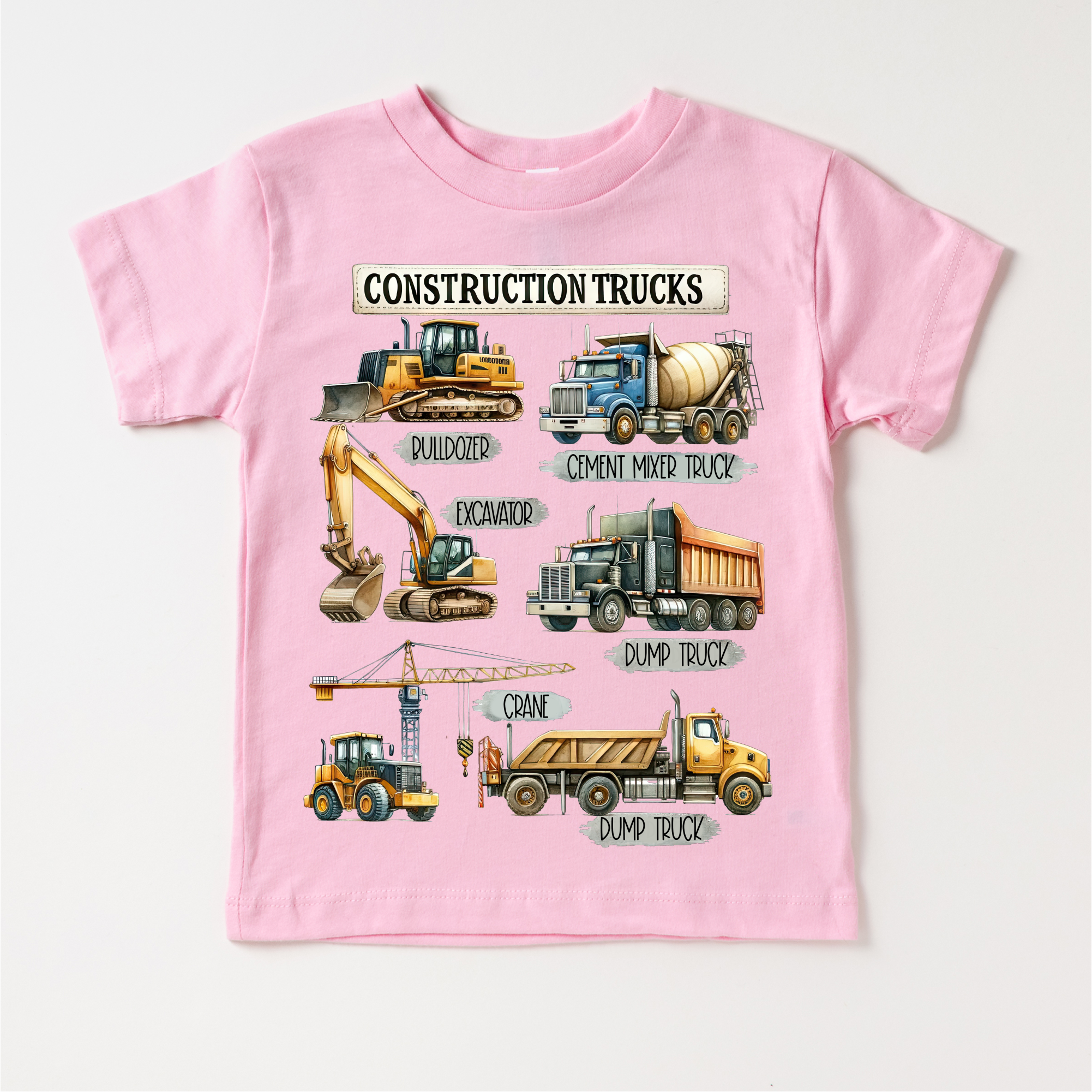 Pink t-shirt with construction vehicle illustrations and labels on a white background