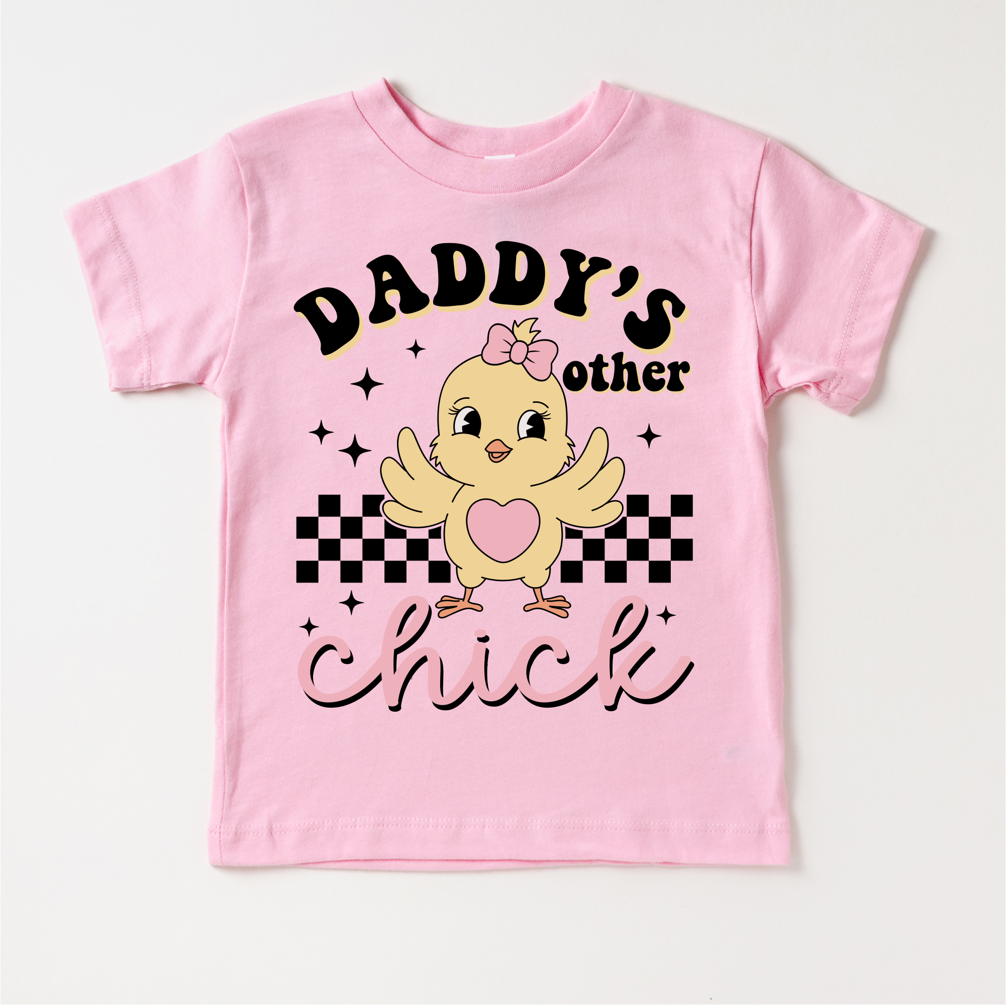 Pink children's t-shirt with a chick graphic and text on a white background