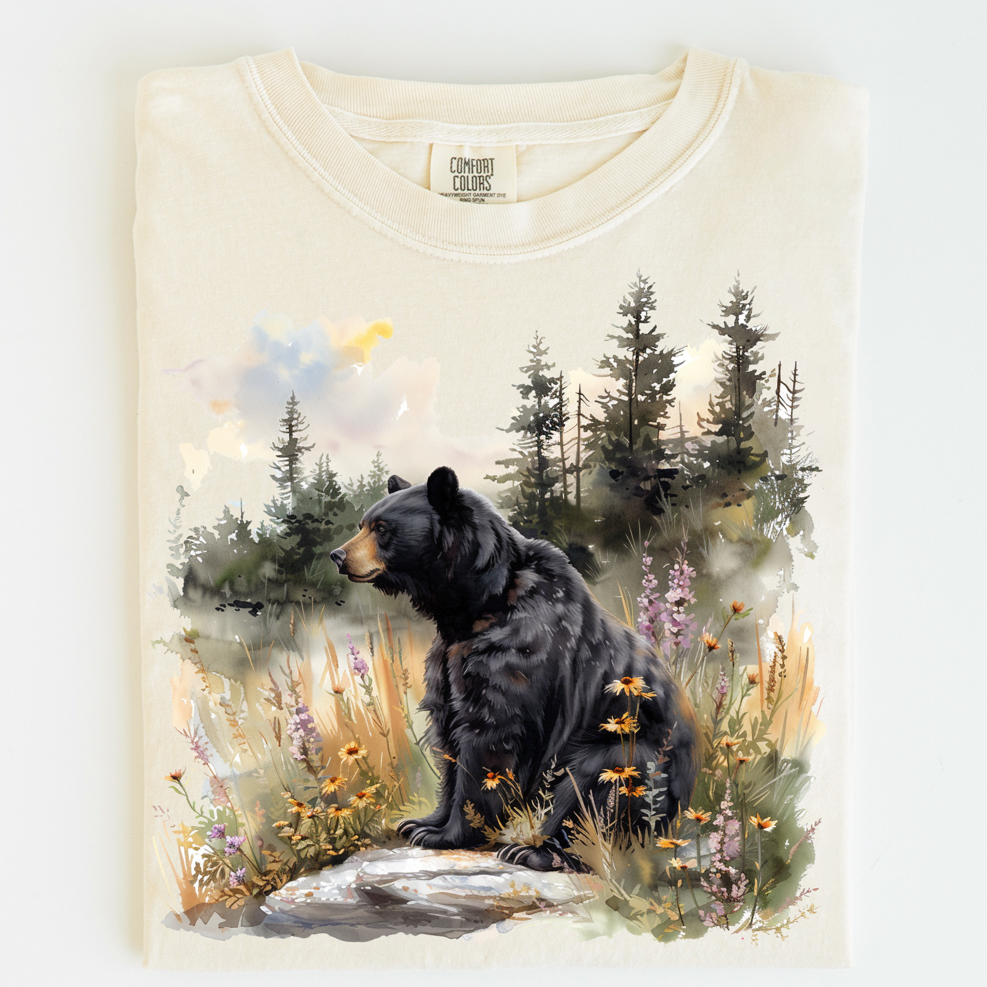 T-shirt with a bear and forest design on a white background