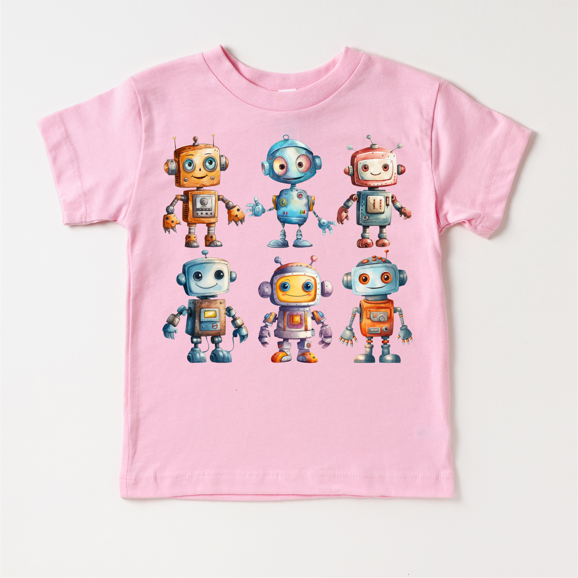 Pink t-shirt with robot illustrations on a white background