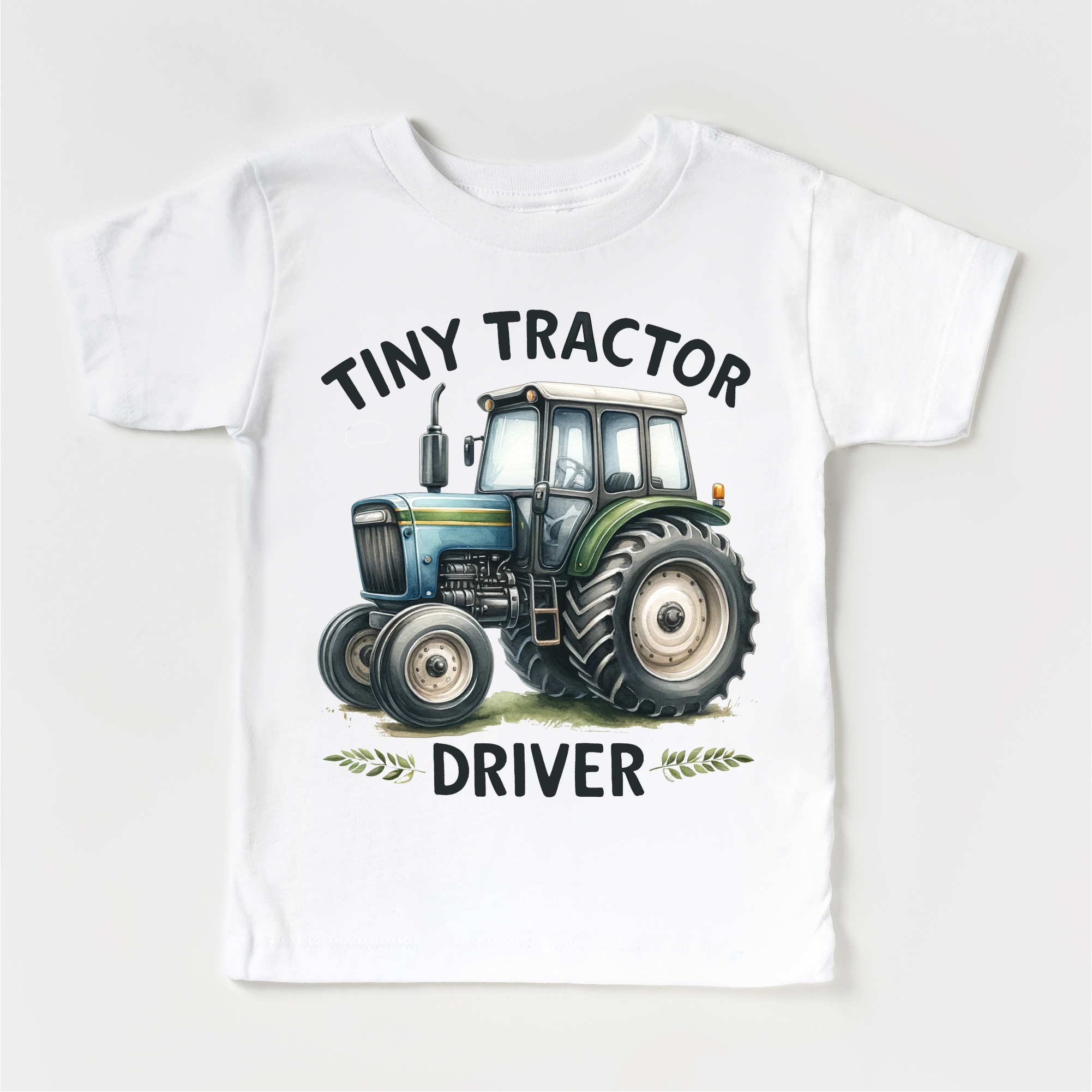 White t-shirt with a tractor graphic and text on a white background