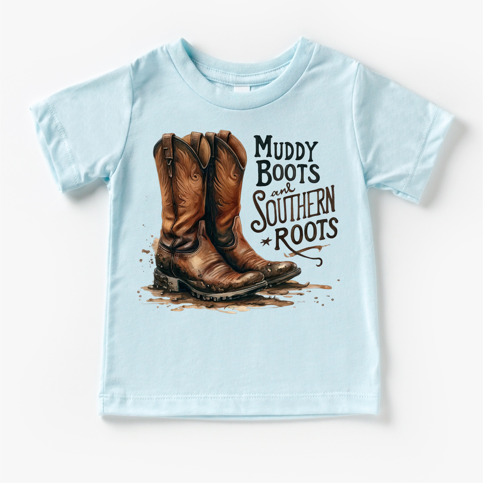 Light blue t-shirt with cowboy boots and 'Muddy Boots and Southern Roots' text on a white background