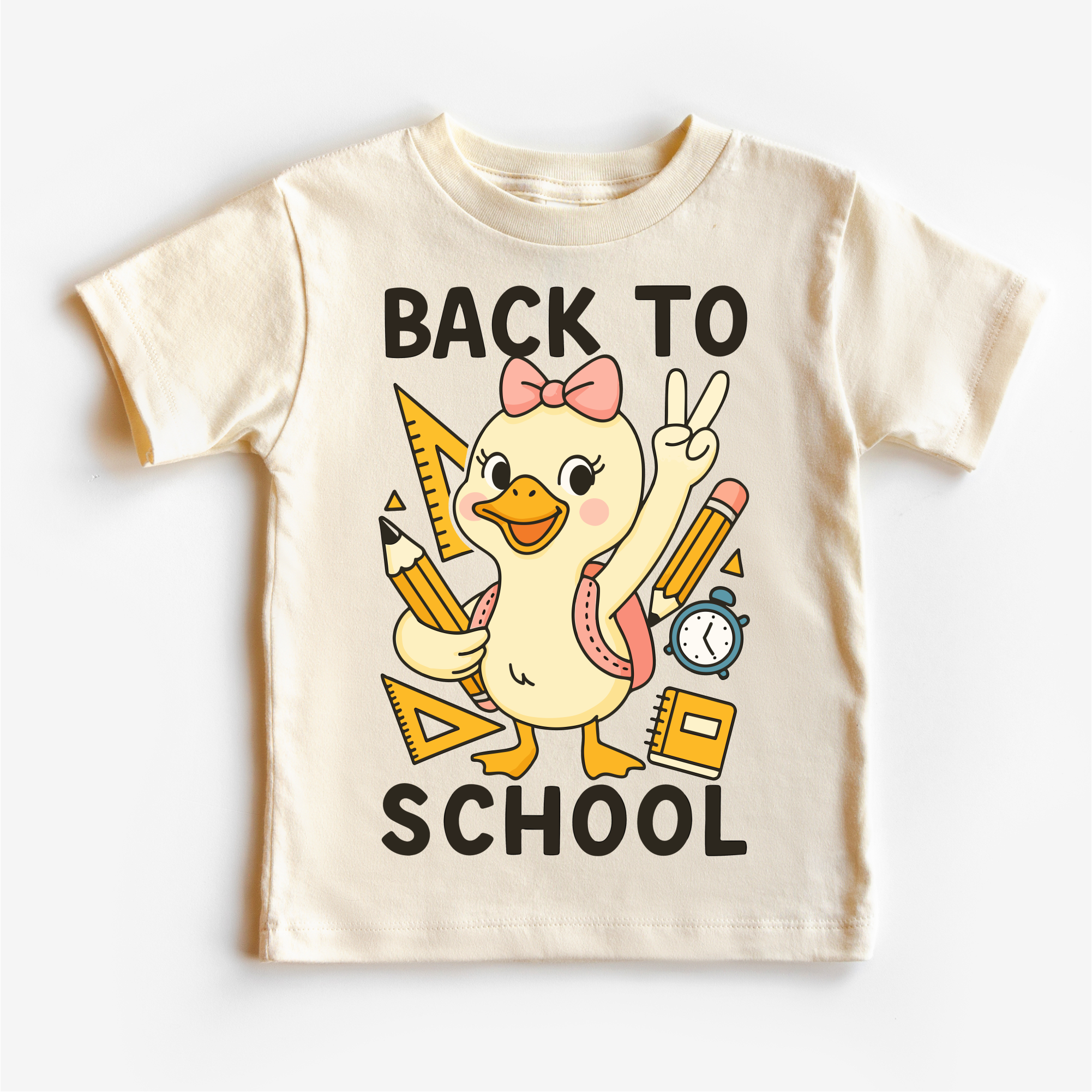 Children's t-shirt with a cartoon duck holding school supplies and 'Back to School' text on a white background.