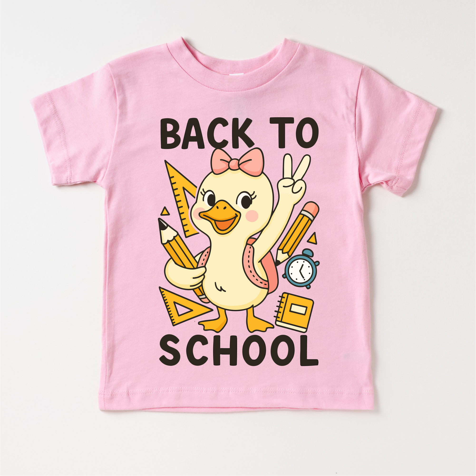 Pink children's t-shirt with a cartoon duck and 'Back to School' text on a white background