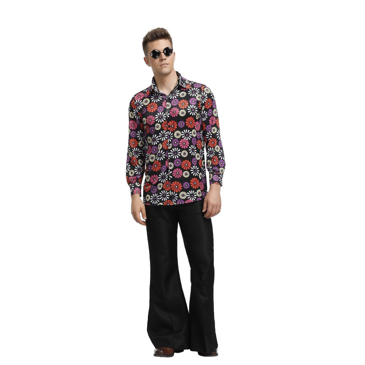 Man wearing a colorful floral shirt and black pants on a white background