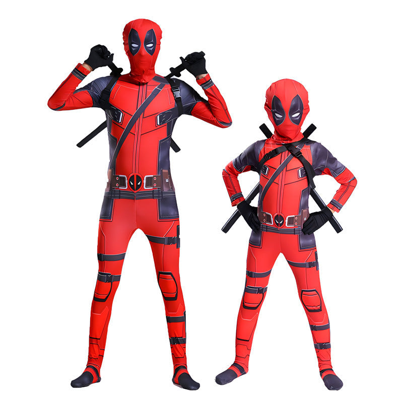 Two people wearing red superhero costumes with black accents on a white background