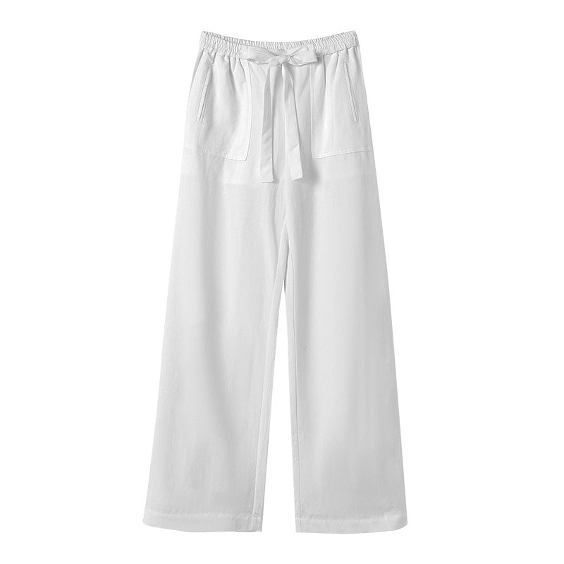 White wide-leg pants with a tie waist on a white background