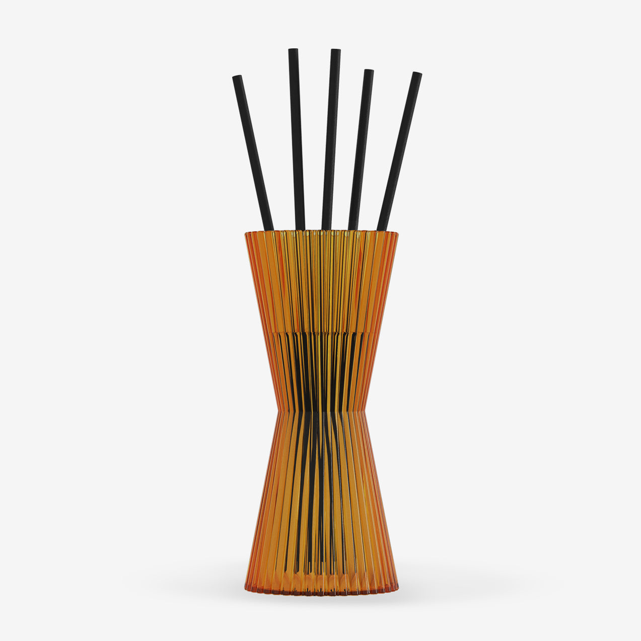 Reed diffuser with black reeds in a wooden holder on a white background