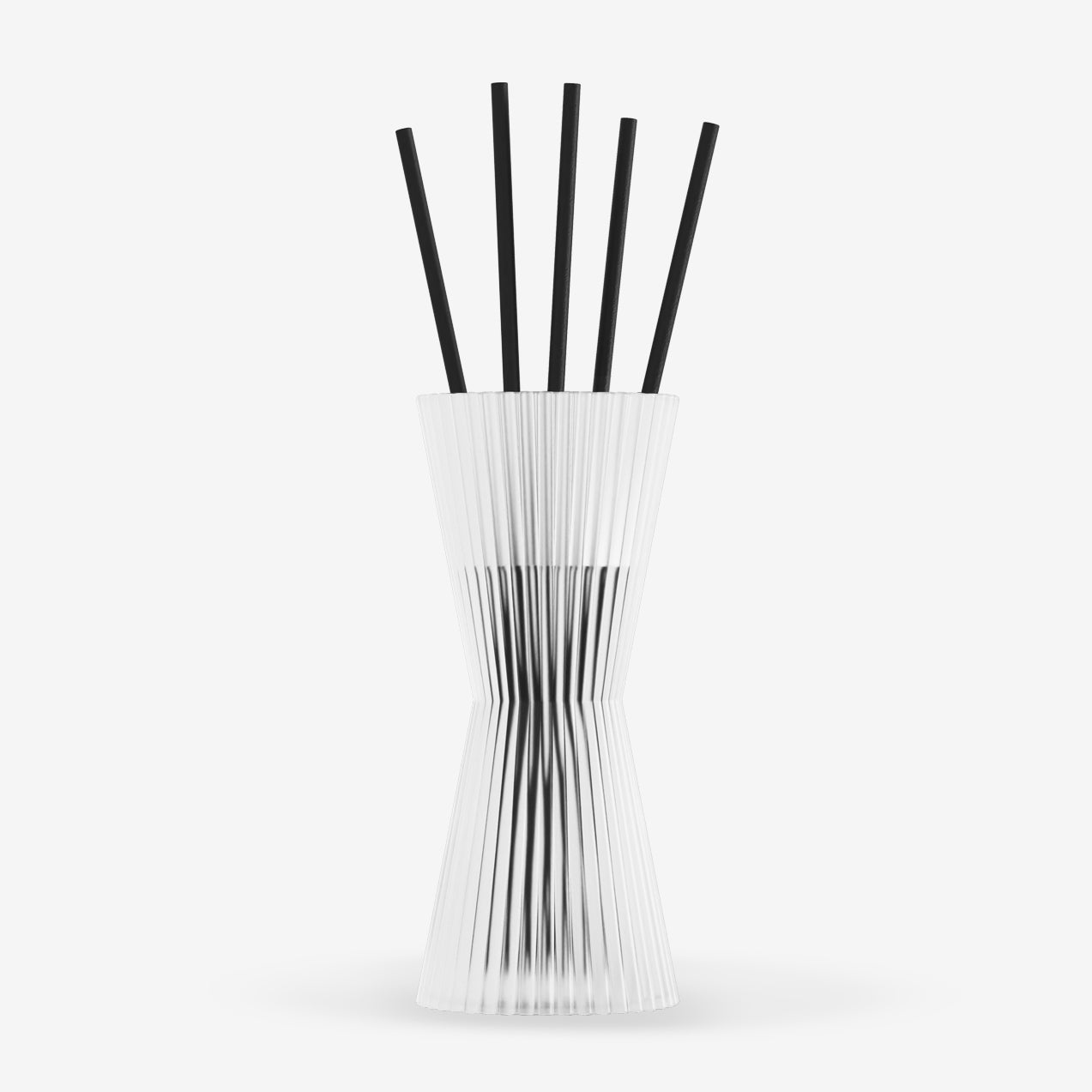 Set of black chopsticks in a white holder on a white background