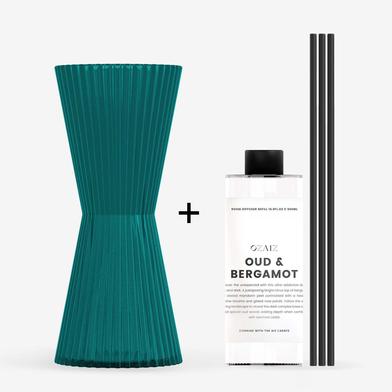Teal diffuser, bottle labeled 'Oud & Bergamot', and black sticks on a white background