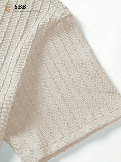 Close-up of beige textured fabric with 'YBB' branding.