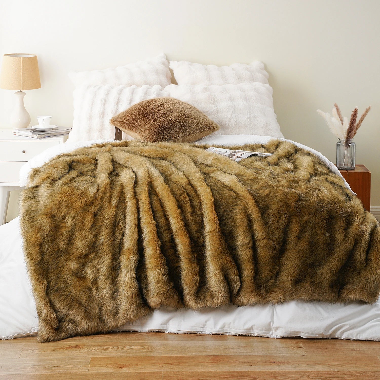 Brown fur throw blanket on a bed in a bedroom setting