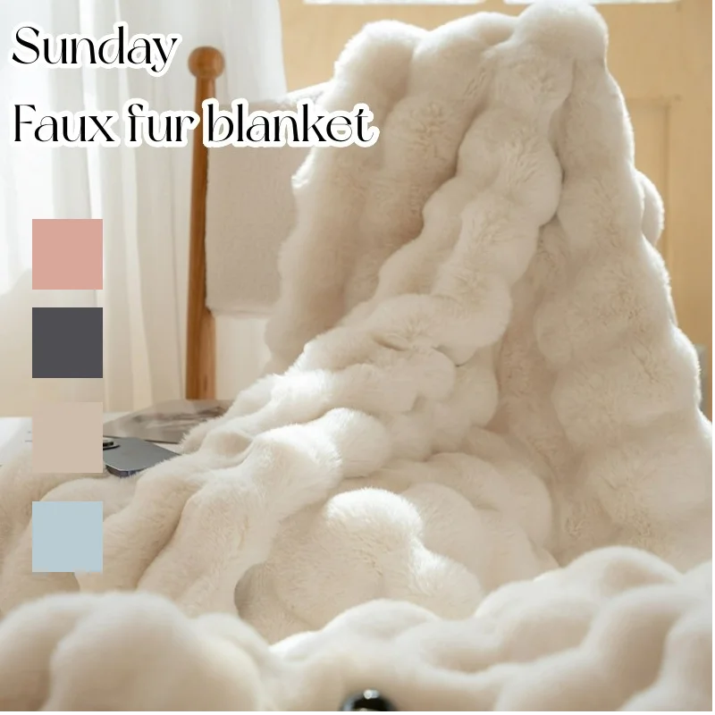 Beige faux fur blanket draped over a chair with color swatches below.