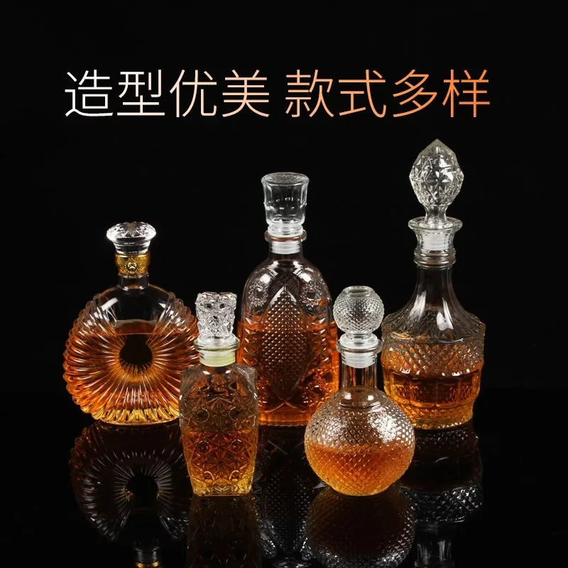 Set of glass decanters with different designs on a black background