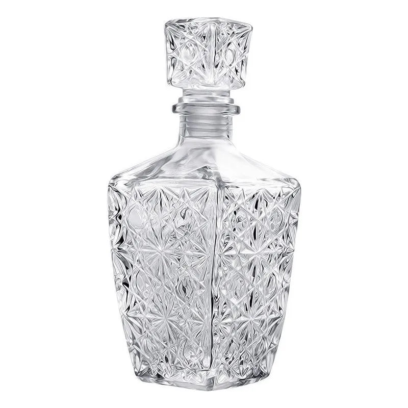 Clear glass decanter with star-shaped cut patterns on a white background