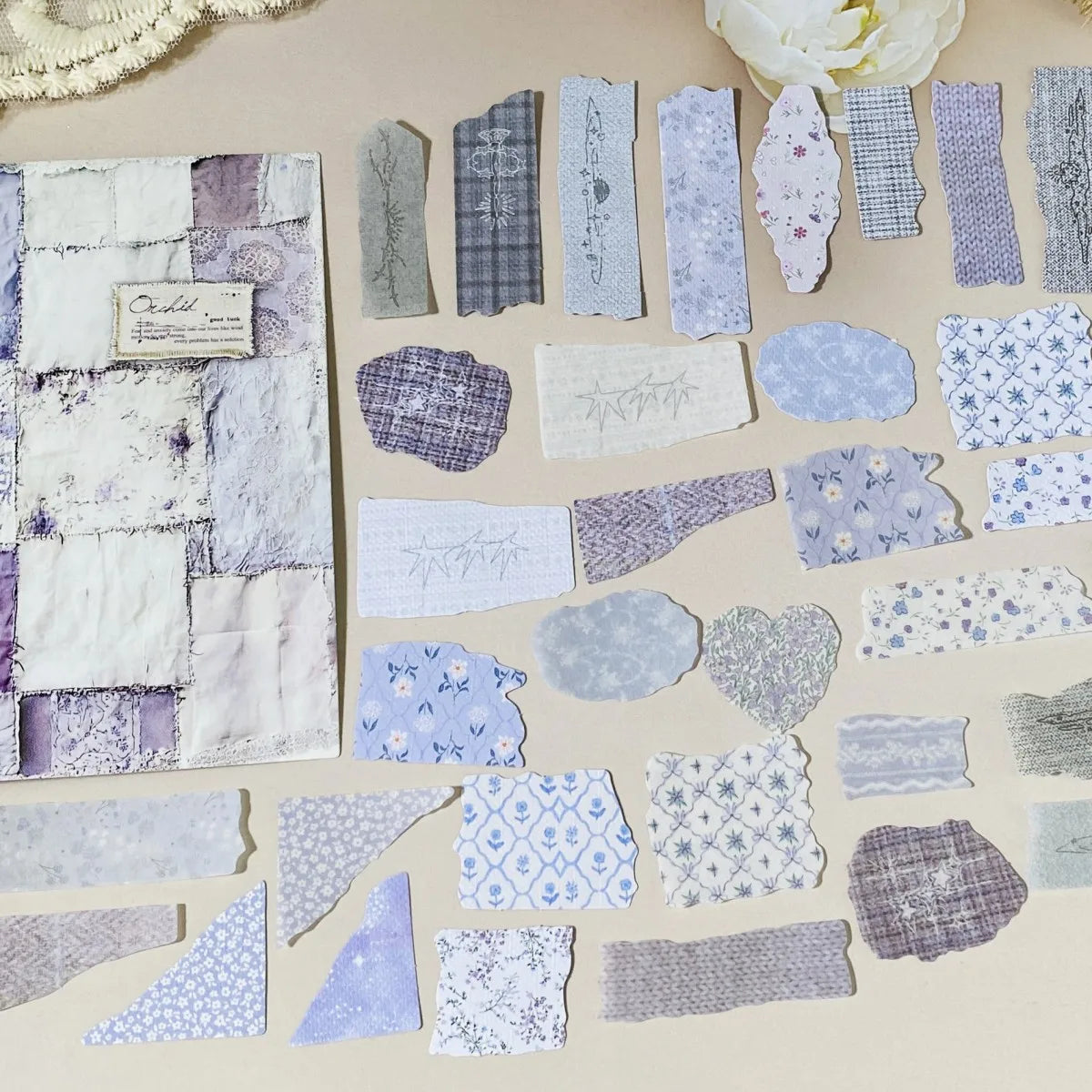 Collection of variously shaped and patterned fabric swatches on a beige background