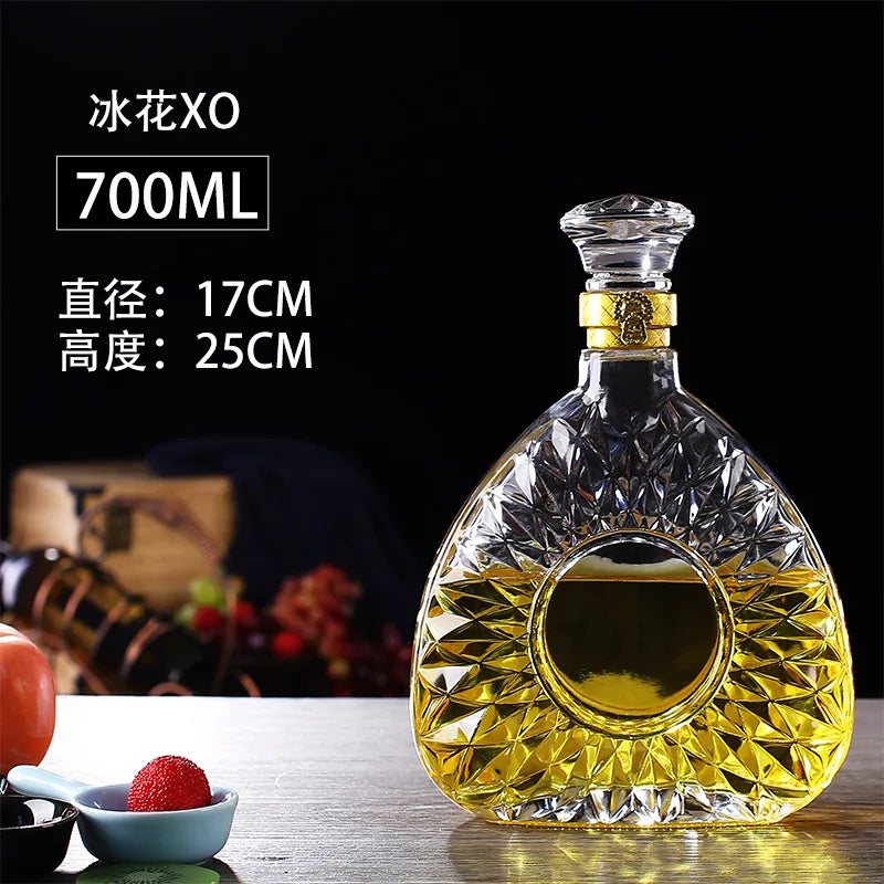 Crystal decanter with gold base on a dark background