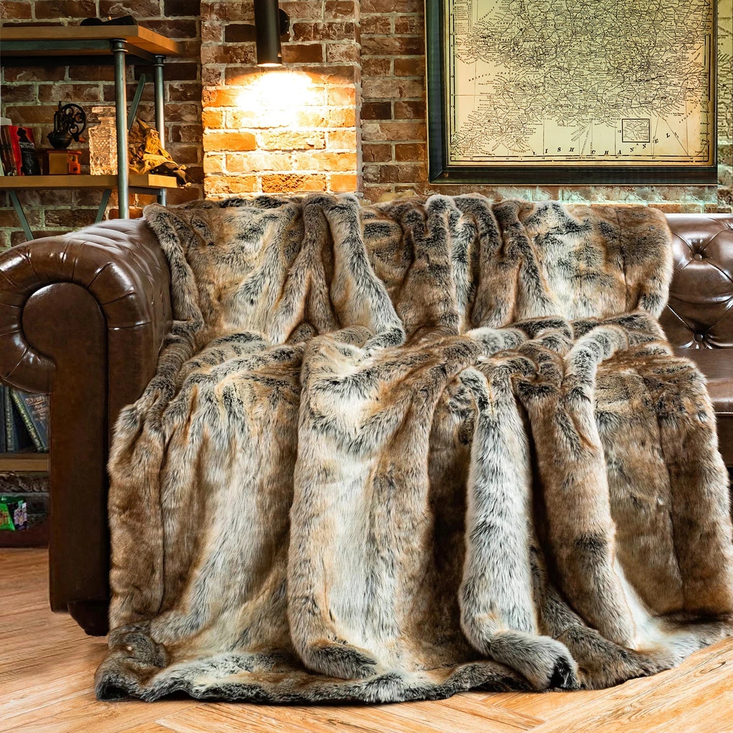Brown leather sofa with a fur throw blanket in a cozy living room setting.