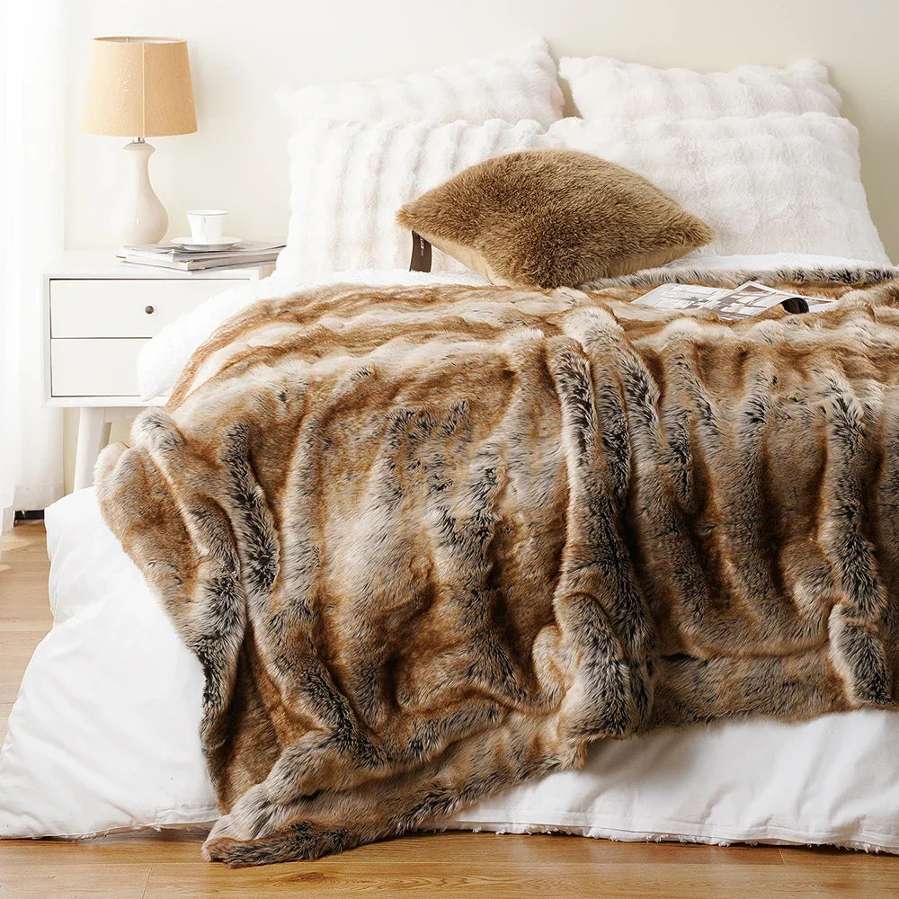 Brown faux fur blanket on a bed in a bedroom setting