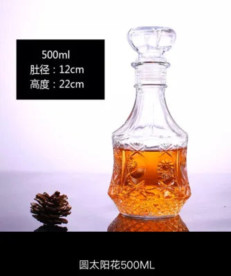Glass decanter with brand name on a reflective surface