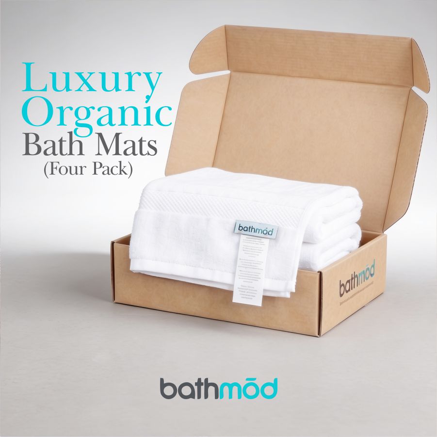 Box of luxury organic bath mats with 'bathmod' branding on a light gray background