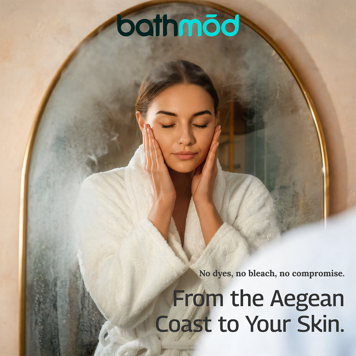 Woman in a white robe standing in front of a mirror with 'bathmod' branding.