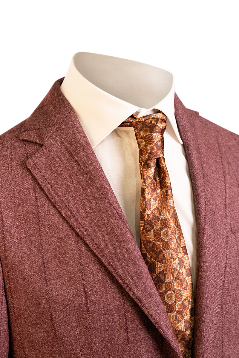 Mannequin wearing a maroon suit with a patterned tie on a white background